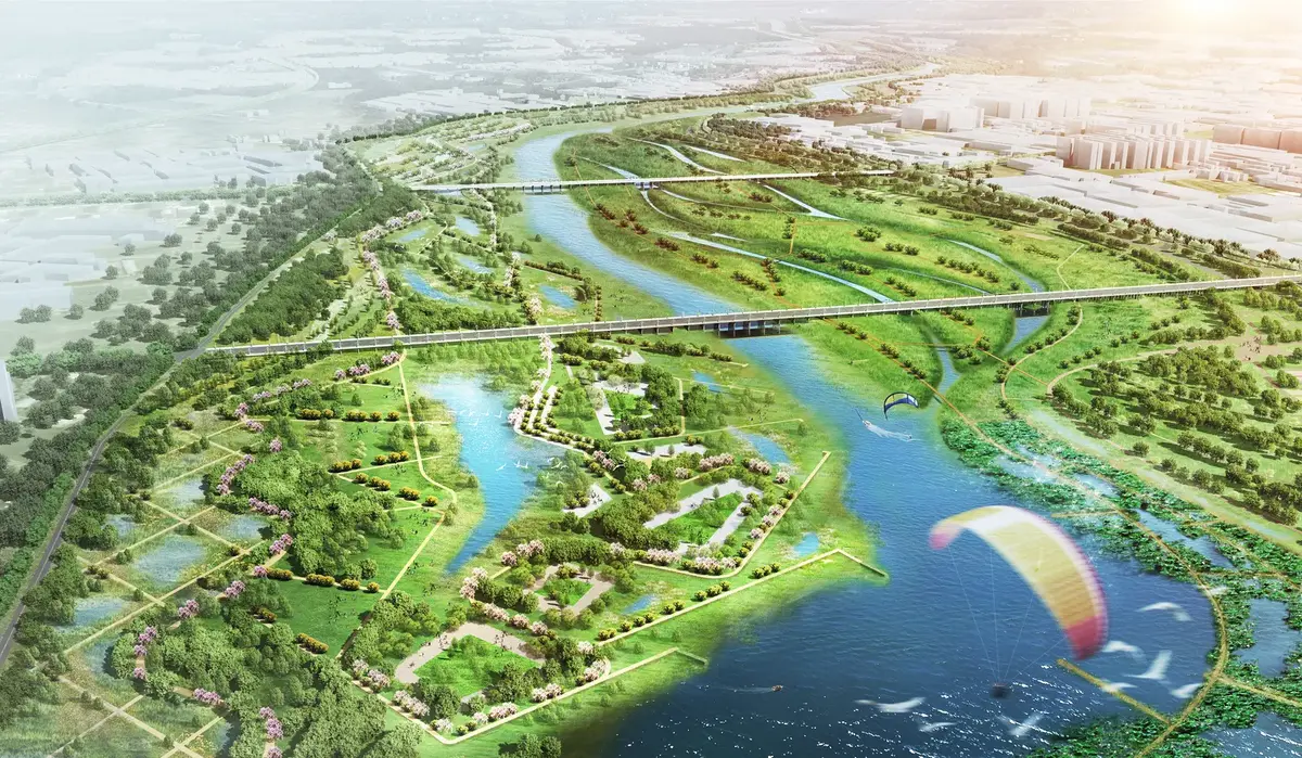 Aerial rendering of a river splitting into vegetated side channels and wetlands, crossed by two bridges, with a paraglider above.